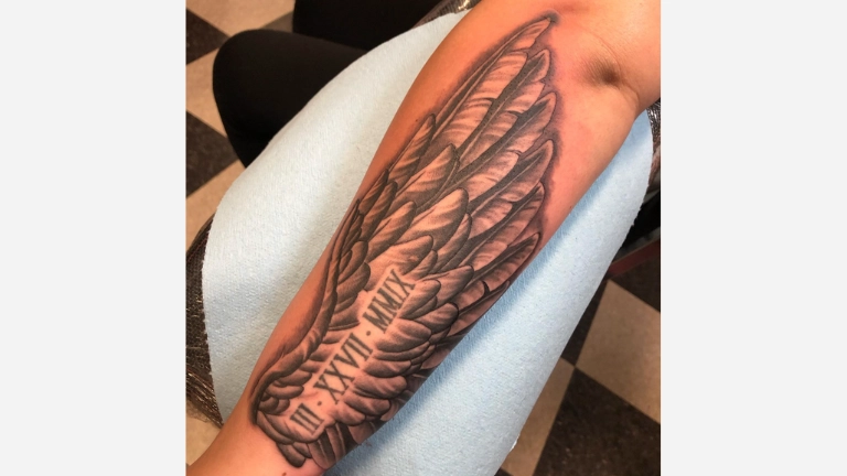 Roman Numeral Feather Tattoo