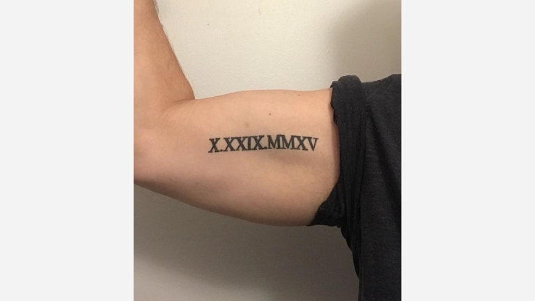 Roman Numeral Bicep Tattoo 