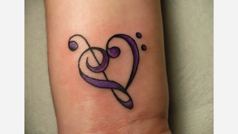 Heart Playing Tattoo