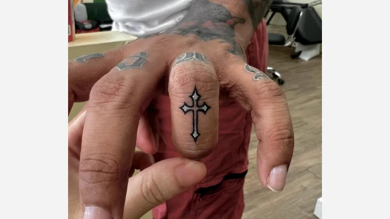 Cross Finger Tattoo